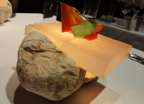 Compressed watermelon, accompanied by Humboldt Fog goat cheese and red onion, topped with a sliver of pickled red onion glass