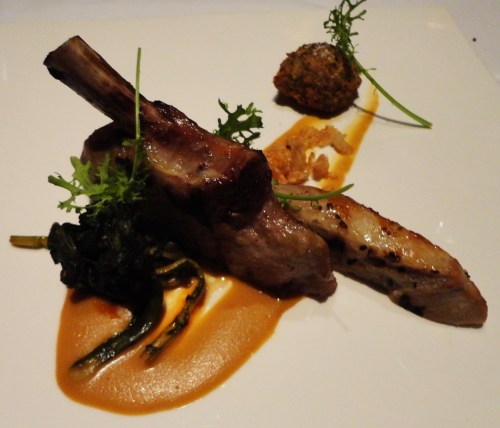 Berkshire Pork Rib Chop  served with Apple Wood-Smoked bacon, Kim Chee, Oats, and Liquid Cornbread