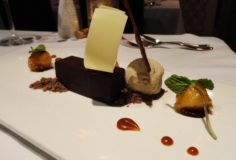 Banana complemented with dark chocolate ganache, coconut, coffee, and salted caramel